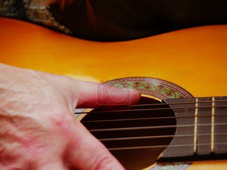 Photo for Musician playing acoustic guitar close up shot selective focus - Royalty Free Image