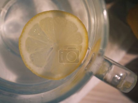 Photo for Hot Lemon drink for natural treatment of cold and flu natural treatment of cold and flu close up overhead flat lay shot selective focus - Royalty Free Image