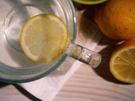 Photo for Hot Lemon drink for natural treatment of cold and flu natural treatment of cold and flu close up overhead flat lay shot selective focus - Royalty Free Image