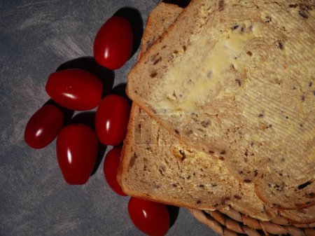 Slices of wholemeal bread and tomatoes close up flat lay overhead close up shot selective focus