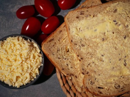 Slices of wholemeal bread cheese and tomatoes close up flat lay overhead close up shot selective focus