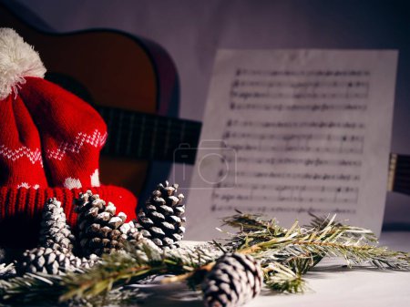 Christmas carols with pine cones and needles winter display medium shot selective focus
