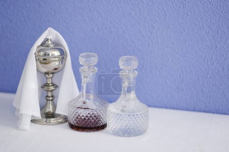 Photo for Cruets with water and wine and chalice - religious objects - Royalty Free Image