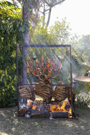Photo for Barbecue set up for barbecue in the style of ground fire - Royalty Free Image