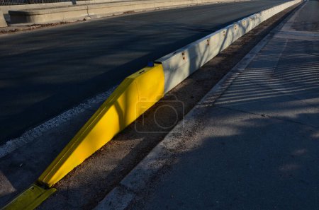 Photo for Temporary steel mobile guardrail assembly easily disassembledlane splitting and traffic diversion barrier at lane to lane crossing. short-term or long-term road closures and modernization, plug-in - Royalty Free Image