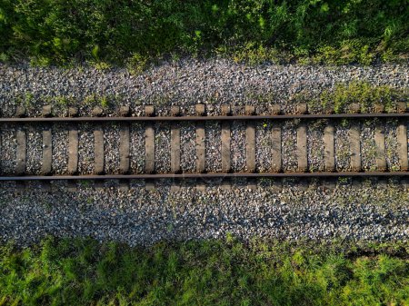 fly over train tracks in the countryside. vertical view of the landscape. background, texture modellers, transport journalists theme. background from above video