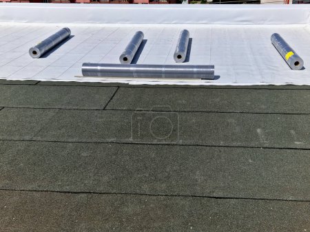 Photo for Waterproofing foils based on PVC-P reinforced with UV-resistant polyester mesh can be exposed directly to weathermembranes have a reinforcement fully integrated into the smooth matte top layer - Royalty Free Image