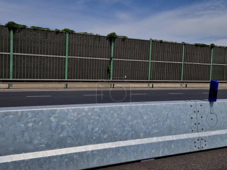 Photo for Temporary steel mobile guardrail assembly easily disassembledlane splitting and traffic diversion barrier at lane to lane crossing. short-term or long-term road closures and modernization, plug-in - Royalty Free Image