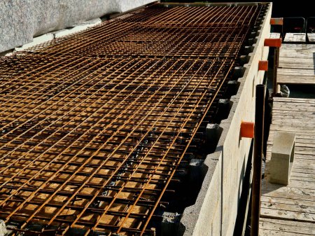 Photo for Formwork in front of the concrete ceiling. the wires are like a net that stays inside the structure of the columns, reinforcement strengthens building even against an earthquake. pipe tube drainage - Royalty Free Image