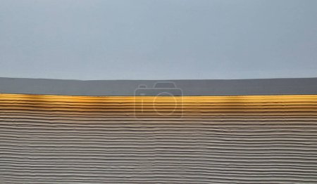 Photo for Soffit with a cornice illuminated by LED strips in the arch. walls lined with brown wooden plywood. light cones make a festive impression. a night club with a great reputation and atmosphere, hall - Royalty Free Image