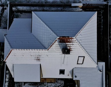 Photo for Checking cleanliness of chimney using a drone. Cleanliness is essential for safety and risk of soot ignition. drone equipped with a camera inspects high on roof. chimney work, red, pattern, table top - Royalty Free Image
