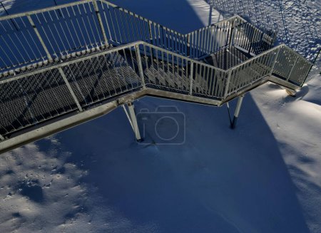 Photo for Industrial hall, warehouse has a steep staircase with high resistance even under heavy load galvanized steel floor grate and railings. expanded metal, edges of stairs of safety, black, perforated - Royalty Free Image