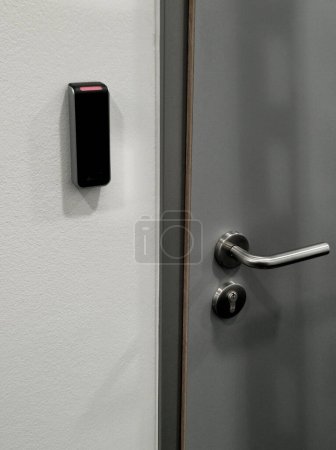 id card opens individual doors. the gray surface of the door with a stainless steel handle is an interior corridor. can only be opened by authorized persons equipped with a chip card