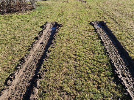 spring rains waterlogged the soil profile and lawns and meadows are mud traps for heavy vehicles. impenetrable by spring snowmelt. the rutted tracks of the car that came back