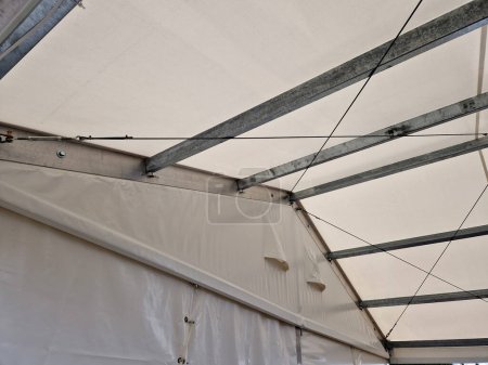 Sheets made of non-flammable materialPVC tarpaulin for trucks rear entrance equipped with zip windows made of transparent plastic Steel frame of the tent made of galvanized girder, beam, mountain