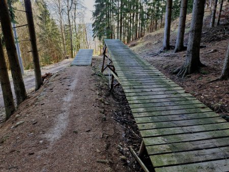 jumps and the construction of benches for jumps and terrains of dirt inclined paths in the former bobsleigh track, now used as cycle tracks for enduro cyclists. long flights over the abyss