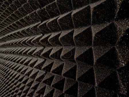 anti noise materials for door fillings and recording studios. foam with an articulated pyramid pattern. padding shattering sound waves in the apartment, theatre, red, cinema, suede, upholstery