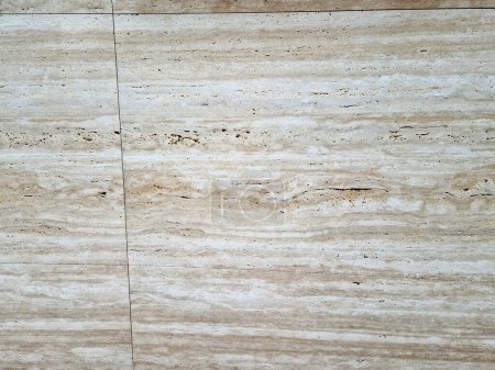 Travertine isa common natural stone that is used in bathrooms. Unpolished travertine stone has a naturally nonslip texture. This makes it great for being installed in bathrooms, showers and floors.