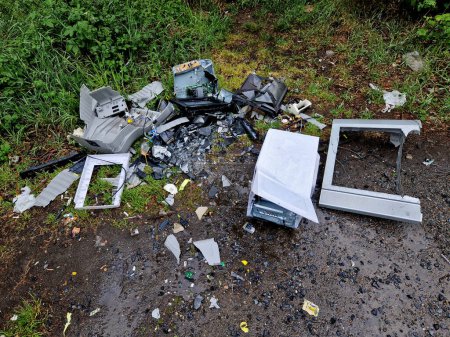 smashed computers in a roadside ditch. hazardous waste belonging to the electrical waste container for recycling. third world country. advanced waste sorting platinum and gold