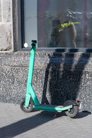 Photo for Electric scooter near store wall, selective focus - Royalty Free Image