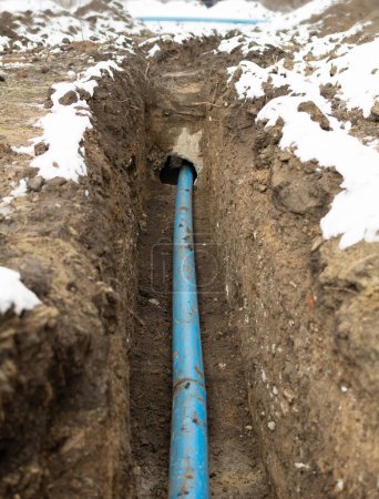 Photo for Plumbing pipe laying. Plastic polypropylene pipe. Sanitary, sewer drainage system for a multi-story building. Civil infrastructure pipe, water lines and storm sewers. Selective focus, shallow depth - Royalty Free Image