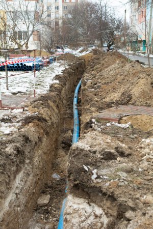 Photo for Plumbing pipe laying. Plastic polypropylene pipe. Sanitary, sewer drainage system for a multi-story building. Civil infrastructure pipe, water lines and storm sewers. Selective focus, shallow depth - Royalty Free Image