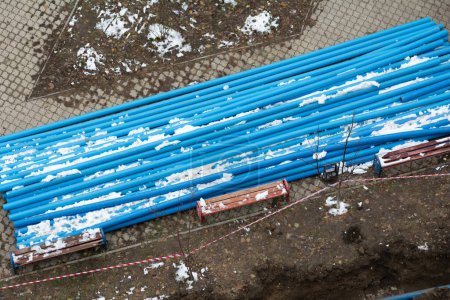 Photo for Blue Plumbing pipes. Plastic polypropylene pipe. Sanitary, sewer drainage system for a multi-story building. Civil infrastructure pipe, water lines and storm sewers. Selective focus, shallow depth - Royalty Free Image