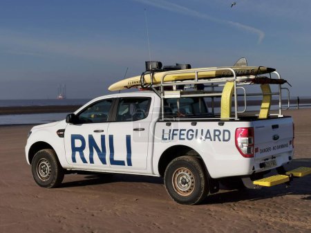 Téléchargez les photos : RNLI patrol vehicle on Crosby Beach, England, Europe, UK patrolling the beach for the safety of the many visitors - en image libre de droit