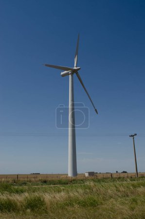 Photo for Windmills with wind energy turbines in the countryside to generate clean energy - Royalty Free Image