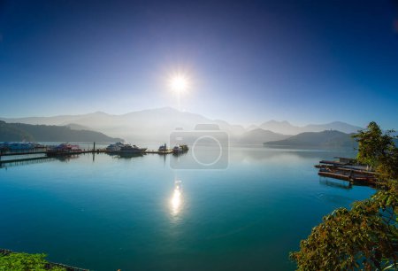 The pier and the lake look stunning in the morning mist. Watch the sunrise. Chaowu Pier, Sun Moon Lake National Scenic Area. Nantou County, Taiwan