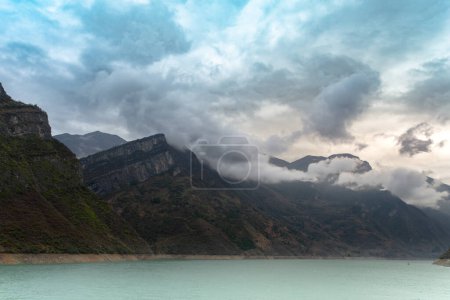 Photo for Enjoy the serenity and majesty of the Three Gorges of the Yangtze River and the majesty of nature amidst the still waters and lofty mountains. - Royalty Free Image