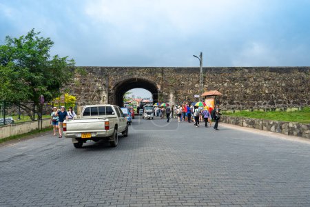 Photo for Galle, Sri Lanka - January 29, 2024: Locals and tourists walk near the historic Galle Dutch Fort under a cloudy sky, showcasing the blend of cultural heritage and daily life. - Royalty Free Image