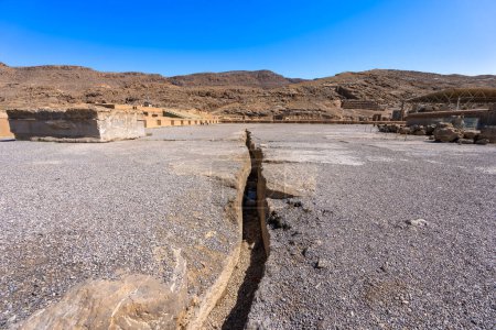 Photo for A vivid portrayal of the cracked earth at Persepolis, revealing the passage of time and natural elements. The contrast between the ancient ruins and enduring mountains, Persepolis, Iran. - Royalty Free Image