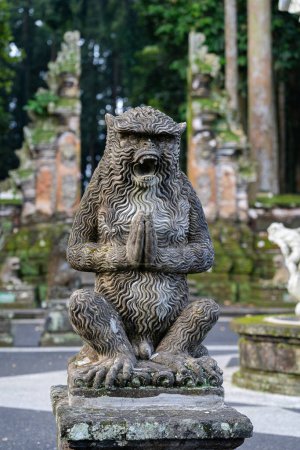 Photo for Monkey statue at Sangeh monkey forest in Bali near Ubud village. Indonesia, vertica - Royalty Free Image
