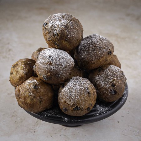 Photo for Traditional Dutch oliebollen, served on New Years Evening, light background - Royalty Free Image