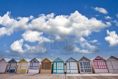 Photo for Colorful beach huts with clouds and skies in Cayeux sur mer, Somme, Normandy, France - Royalty Free Image