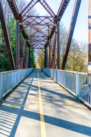 Photo for A bridge with rusty trestles along the Cedar River Trail in Renton, Washington. - Royalty Free Image