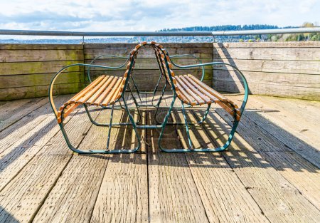 Photo for Curving benches near the water at Gene Coulon Park in Reonton, Washington. - Royalty Free Image