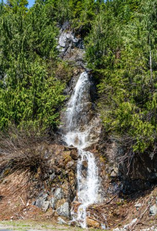 Photo for A view of a waterfall on the side of Highway 410 in Washington State. - Royalty Free Image