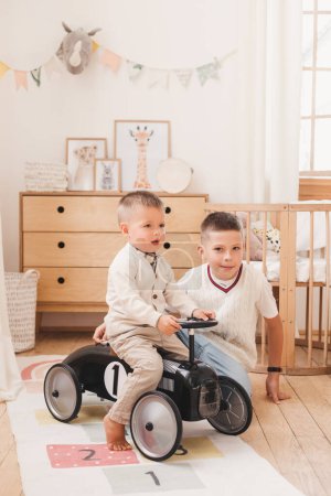 Photo for Two brothers playing in the children room. Happy young children at home. - Royalty Free Image