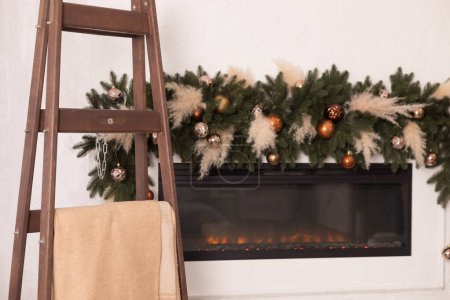 Photo for Christmas fireplace and christmas tree. - Royalty Free Image