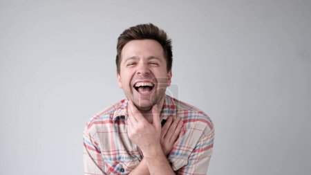 Photo for European young man is laughing loudly. Studio shot - Royalty Free Image
