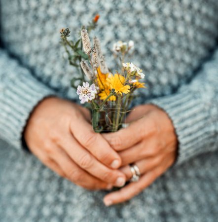 Photo for Romantic image of people and nature with  hands holding natural flowers from field. Spring coming. Concept of easy lifestyle and natural life. Earth's day. Environment and sustainable close up - Royalty Free Image