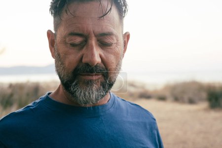 Photo for Sad man portrait expression face close up in outdoor. One adult mature male people with closed eyes looking down. Problems on life. Mental burnout. Depression and therapy. Life trouble person lonely - Royalty Free Image