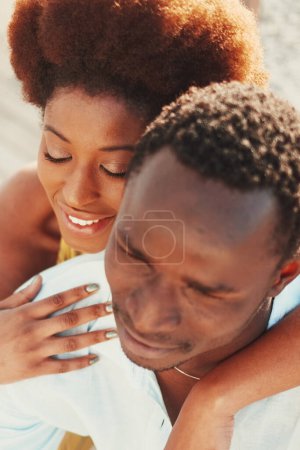 Téléchargez les photos : Above view of young pretty black woman and man together hugging with love and romance. Boyfriend and girlfriend in relationship. Romantic leisure activity concept. Dating. Two people in love - en image libre de droit