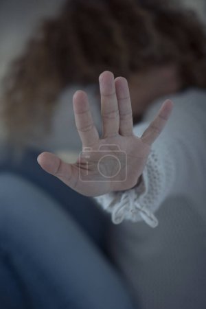 Photo for Violence on women concept at home - close up of woman hands to protect her - crime violent man and house danger situation for females - husband and wife crimes - Royalty Free Image