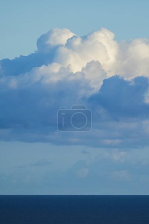 Photo for Beautiful blue coloured background of sea ocean water and horizon line with white clouds in the sky - concept of travel and nature - Royalty Free Image