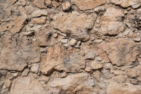 Foto de Fondo con una textura de un antiguo muro de piedra en excavaciones arqueológicas en la ciudad de Hebrón, Cisjordania - Imagen libre de derechos