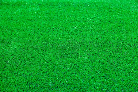 Photo for Close-up texture of vibrant green artificial grass for sports fields. - Royalty Free Image