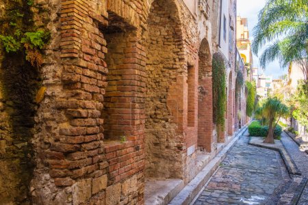 Photo for Naumachia or Naumachie of Taormina is ruins of ancient brick wall in Taormina old town on Sicily island, Italy. - Royalty Free Image